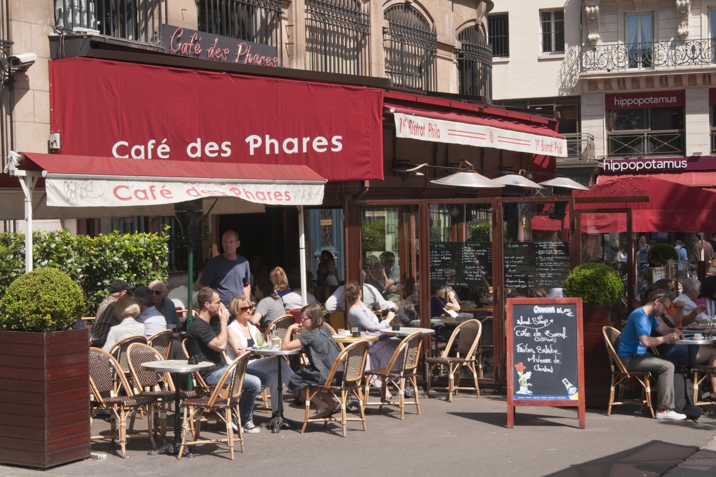 People sitting at a cafe in Paris, France