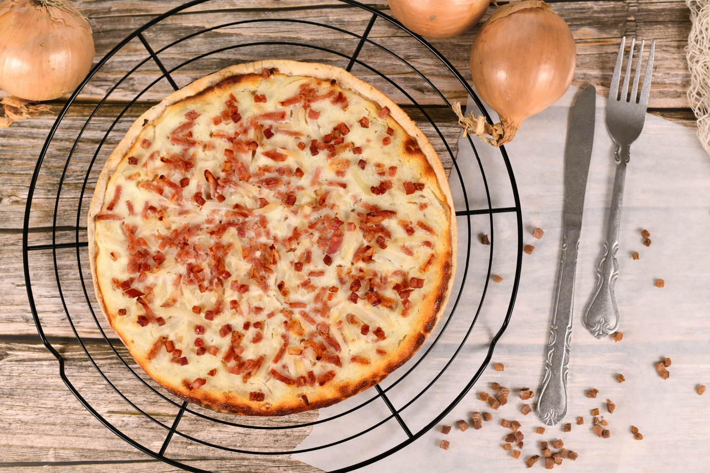 Taditional food 'Tarte Flambee' or 'Flammkuchen' from German-French Alsace border region.