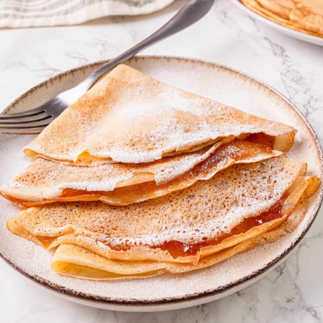 Two crepes in Amsterdam covered in chocolate sauce